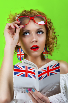 a girl holds turned upside-down book
